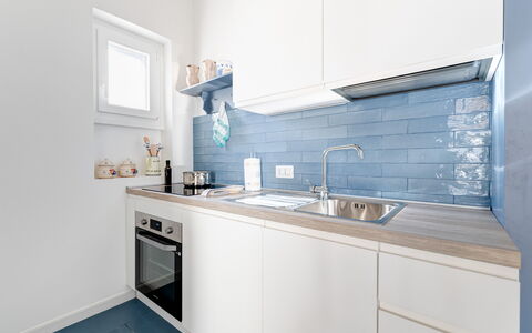 Villa Azzurra Monticelli: Kitchen, Major Appliance, Flooring, Countertop, Interior Design, Kitchen Appliance, Floor, Cabinetry, Home, Furniture