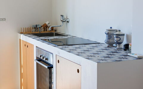 Newly Renovated Ocean View Flat: Kitchen, Wood, Kitchen Appliance, Flooring, Countertop, Major Appliance, Floor, Interior Design, Kitchen Stove, Furniture