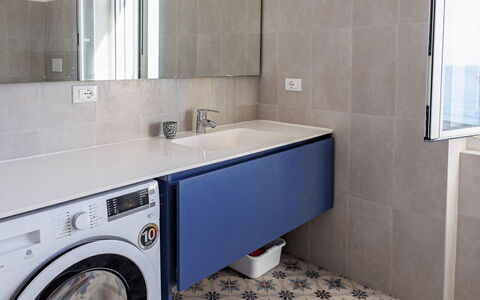 Newly Renovated Ocean View Flat: Washing Machine, Flooring, Floor, Clothes Dryer, Laundry Room, Plumbing Fixture, Interior Design, Tile, Bathroom, Composite Material
