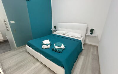 Appartamento Gianira: Floor, Flooring, Furniture, Interior Design, Bedroom, Room, Bed, Bedding, Apartment, Bed Sheet