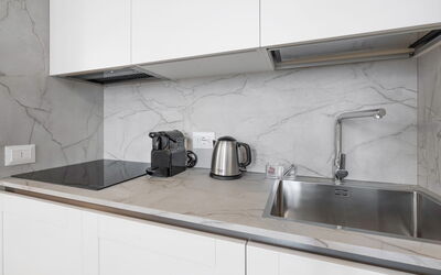 Deservi Elegant Apt. Donatello: Countertop, Kitchen, Flooring, Interior Design, Kitchen Appliance, Floor, Cabinetry, Tap, Sink, Home Appliance