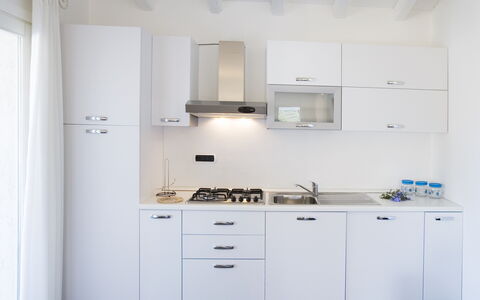 Villa Leccio 2: Kitchen, Major Appliance, Kitchen Appliance, Countertop, Cabinetry, Interior Design, Kitchen Stove, Home Appliance, Kitchen Sink, Flooring