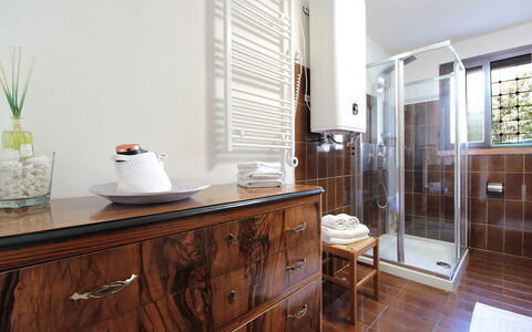 Villa Rosa Apartment: Interior Design, Flooring, Plumbing Fixture, Wood, Floor, Cabinetry, Furniture, Bathroom Cabinet, Lighting, Bathroom