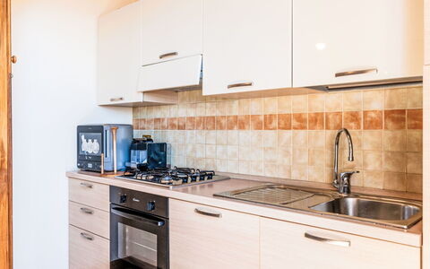 Casa del Mare: Kitchen, Major Appliance, Wood, Kitchen Appliance, Countertop, Interior Design, Flooring, Cabinetry, Floor, Home