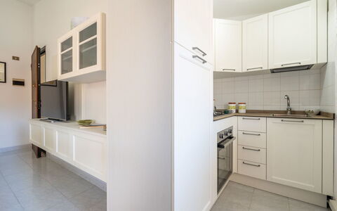 Carigi: Kitchen Appliance, Kitchen, Countertop, Flooring, Interior Design, Major Appliance, Cabinetry, Wood, Floor, Ceiling