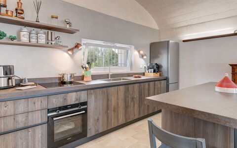 Trulli di Luccio: Kitchen, Countertop, Wood, Kitchen Appliance, Interior Design, Home Appliance, Major Appliance, Flooring, Ceiling, Cabinetry