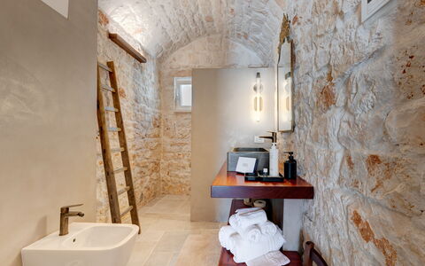 Trulli di Luccio: Wall, Flooring, Plumbing Fixture, Interior Design, Floor, Ceiling, Lighting, Bathroom, Plumbing, Light Fixture
