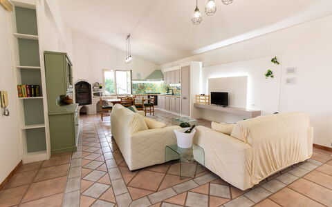 Villa Ninfa: Interior Design, Furniture, Flooring, Floor, Couch, Ceiling, Wood, Room, Living Room, Lighting