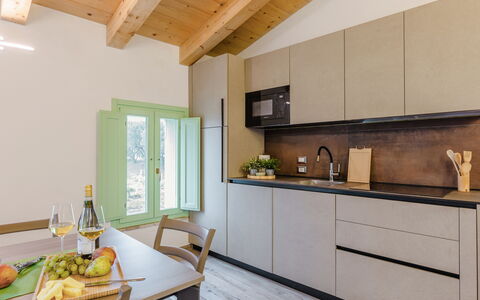Zena Suite: Kitchen, Countertop, Interior Design, Furniture, Flooring, Wood, Kitchen Appliance, Cabinetry, Home, Major Appliance