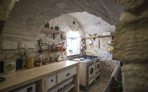 Trulli Experience, Pool, Monopoli: Wall, Interior Design, Furniture, Ceiling, Kitchen, Stone Wall, Chair, Natural Material, Tile, Shelf