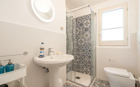 Pellicano: Bathroom, Toilet Seat, Flooring, Floor, Plumbing Fixture, Toilet, Interior Design, Tile, Bathroom Sink, Plumbing