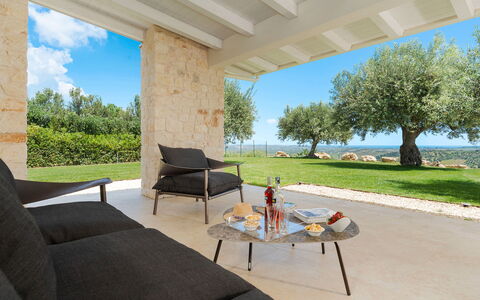 Villa Netina: Furniture, Chair, Outdoor Furniture, Shade, Kitchen & Dining Room Table, Garden, Coffee Table, Landscaping, Design, Armrest