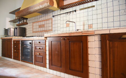 La Casa nel Bosco: Flooring, Wood, Kitchen, Cabinetry, Countertop, Floor, Interior Design, Brown, Wood Stain, Kitchen Sink