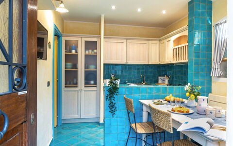 Suite la Torre: Interior Design, Flooring, Furniture, Kitchen, Floor, Countertop, Ceiling, Room, Lighting, Cabinetry