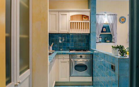 Suite la Torre: Kitchen, Countertop, Kitchen Appliance, Major Appliance, Interior Design, Flooring, Cabinetry, Floor, Room, Home Appliance