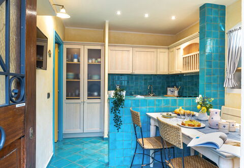 Suite la Torre: Interior Design, Flooring, Furniture, Kitchen, Floor, Countertop, Ceiling, Room, Lighting, Cabinetry