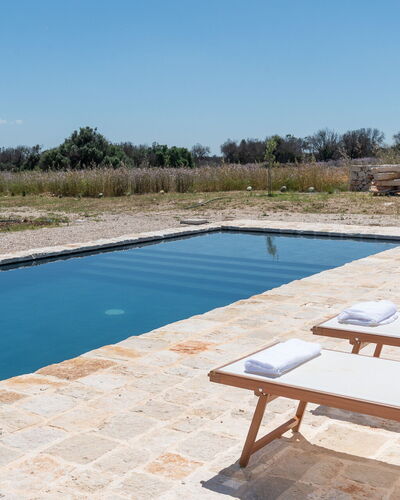 Terracorte Villa: Swimming Pool, Composite Material, Outdoor Furniture, Sunlounger, Reflection, Reflecting Pool, Resort, Flagstone, Chaise Longue