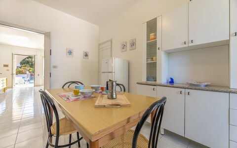 Villetta Bluette, Marina di Mancaversa: Flooring, Interior Design, Furniture, Floor, Ceiling, Countertop, Room, Kitchen, Kitchen & Dining Room Table, Cabinetry