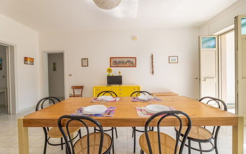 Villetta Bluette, Marina di Mancaversa: Furniture, Interior Design, Flooring, Wall, Floor, Wood, Table, Kitchen & Dining Room Table, Dining Room, Chair