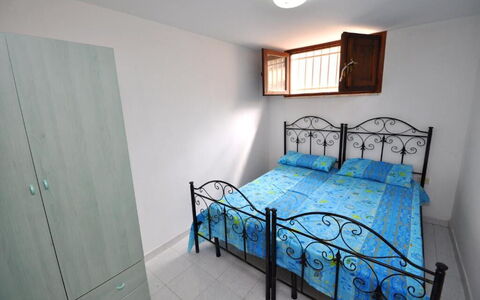 Appartamento Calanca, Marina di Mancaversa: Bed, Bedroom, Bedding, Furniture, Bed Sheet, Floor, Interior Design, Flooring, Room, Apartment
