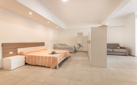 Appartamento Monomare, Gallipoli: Flooring, Floor, Interior Design, Wood, Ceiling, Furniture, Room, Bedroom, Bed, Apartment