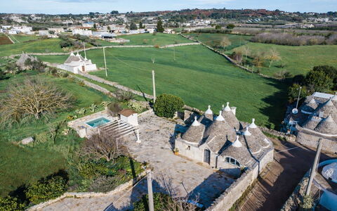 Trulli al Verde Viburno: Wall, Architecture, Landscape, Estate, Landscaping, Stone Wall, Flagstone, Driveway, Village, Walkway