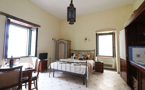 Scilla Centro Storico Otranto: Wall, Furniture, Interior Design, Bedroom, Bed, Ceiling, Flooring, Floor, Room, Lighting