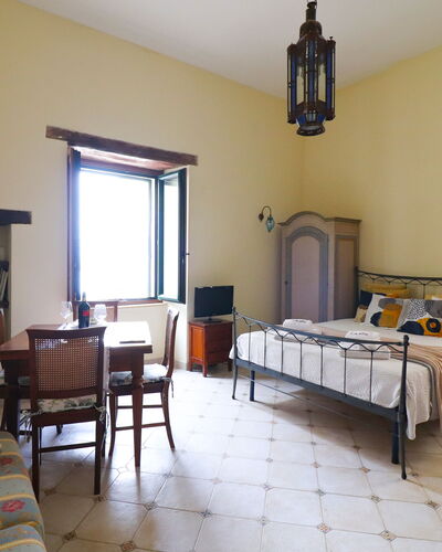 Scilla Centro Storico Otranto: Furniture, Interior Design, Wall, Bedroom, Bed, Flooring, Floor, Ceiling, Room, Lighting