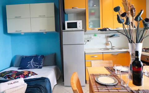 Circe Sea View: Furniture, Room, Interior Design, Apartment, Chair, Major Appliance, Curtain, Kitchen, Home Appliance, Cabinetry