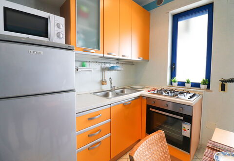 Circe Sea View: Kitchen, Kitchen Appliance, Major Appliance, Countertop, Wood, Kitchen Sink, Kitchen Stove, Cabinetry, Stove, Interior Design