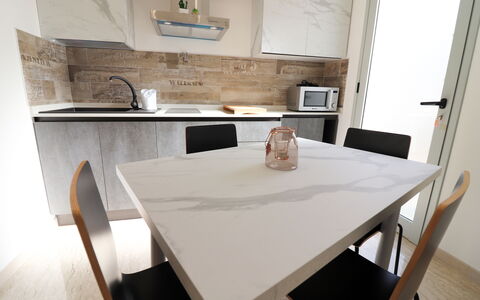 Malika: Furniture, Flooring, Wood, Floor, Interior Design, Kitchen & Dining Room Table, Table, Chair, Countertop, Dining Room