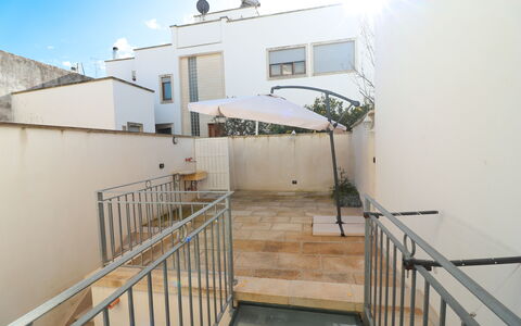 Malika: Floor, Flooring, Handrail, Apartment, Balcony, Stairs, Daylighting, Courtyard, Houseplant, Baluster