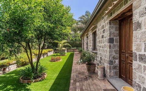 Villa Romantic Garden: Garden, Shrub, Groundcover, Brick, Flagstone, Landscaping, Backyard, Lawn, Yard