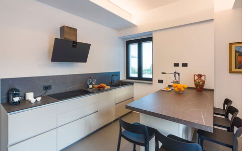 Villa Cloris: Kitchen, Countertop, Interior Design, Kitchen Appliance, Flooring, Kitchen Stove, Major Appliance, Cabinetry, Home Appliance, Furniture