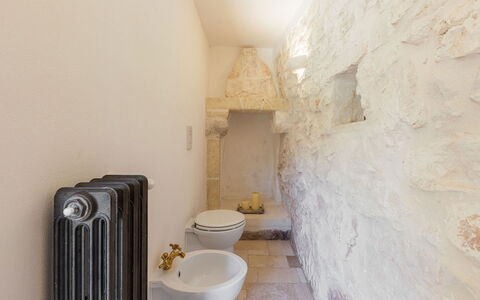 Villa Olivella: Wall, Plumbing Fixture, Bathroom, Toilet, Plumbing, Toilet Seat, Stone Wall, Tile, Ceramic, Tap
