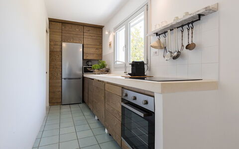 Villa Riva: Countertop, Kitchen, Cabinetry, Kitchen Appliance, Flooring, Furniture, Wood, Interior Design, Major Appliance, Floor