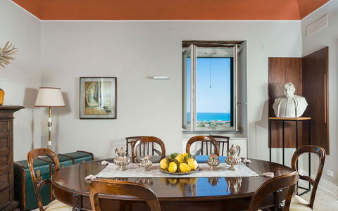 Villa Milo: Furniture, Interior Design, Table, Wood, Flooring, Floor, Kitchen & Dining Room Table, Picture Frame, Lighting, Dining Room