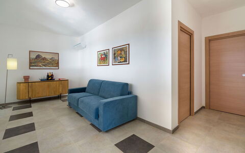 Villa Lily: Furniture, Interior Design, Flooring, Floor, Wall, Couch, Wood, Ceiling, Room, Living Room
