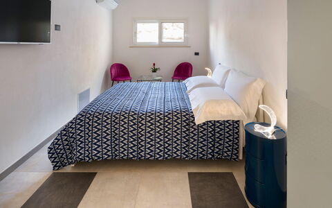 Villa Lily: Interior Design, Furniture, Floor, Flooring, Bedroom, Ceiling, Room, Bed, Lighting, Bed Sheet