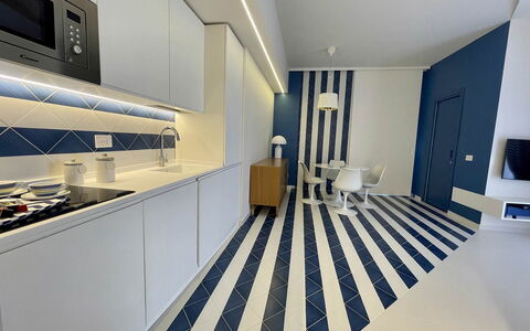 Nole 1: Flooring, Interior Design, Floor, Ceiling, Apartment, Tile, Room, Kitchen, Light Fixture
