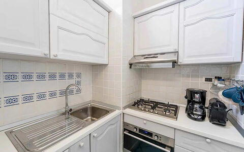 Casa Oscar: Kitchen, Kitchen Appliance, Major Appliance, Countertop, Kitchen Stove, Cabinetry, Flooring, Home Appliance, Stove, Interior Design