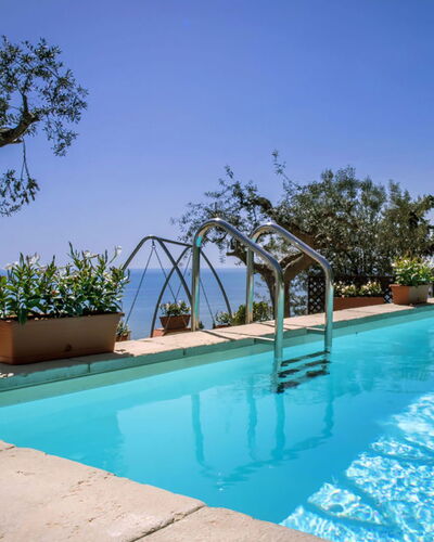 Villa Sea Breeze: Blue, Swimming Pool, Resort, Flowerpot, Eco Hotel, Houseplant, Shade, Hacienda, Villa, Hotel