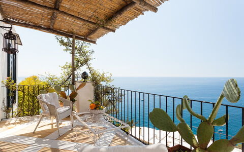Casa Bellevue: Furniture, Chair, Balcony, Sea, Outdoor Furniture, Flowerpot, Coast, Houseplant, Ocean, Resort