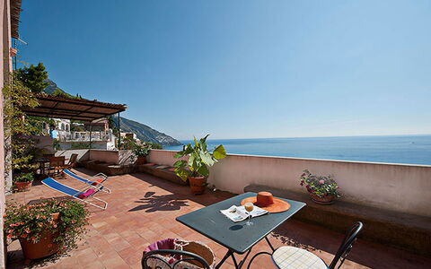 Positano View: Sea, Coast, Coastal And Oceanic Landforms, Balcony, Ocean, Flowerpot, Beach, Shore, Resort, Outdoor Furniture