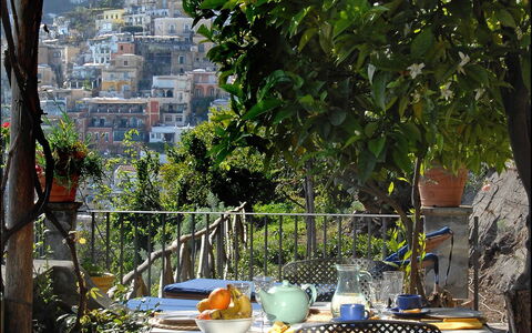 Romantic Tower: Furniture, Chair, Table, Outdoor Table, Outdoor Furniture, Flowerpot, Restaurant, Houseplant, Shade, Garden