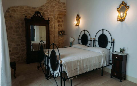 Villa Acreide: Furniture, Floor, Bedroom, Bed, Bedding, Bed Frame, Light Fixture, Lamp, Linens, Bed Sheet