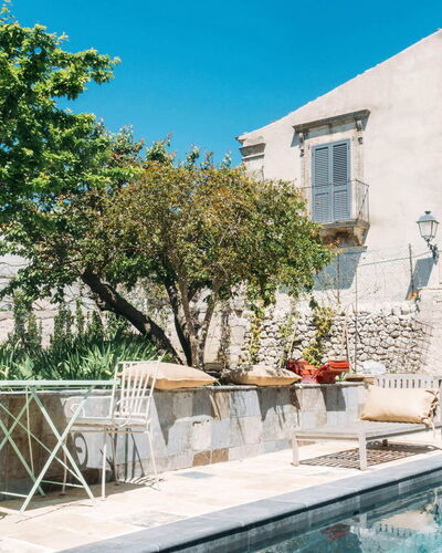 Villa Acreide: Wall, Flowerpot, Outdoor Furniture, Flagstone, Concrete, Houseplant, Courtyard, Chair, Swimming Pool, Villa