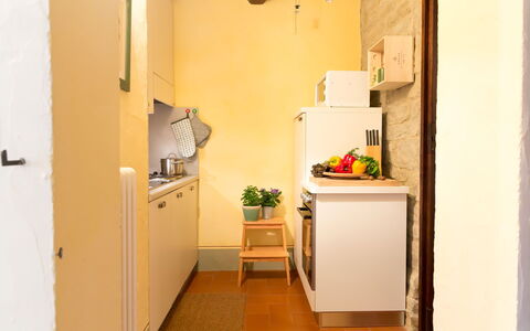 Villa Beatrice: Flooring, Interior Design, Major Appliance, Wood, Kitchen Appliance, Floor, Yellow, Furniture, Kitchen, Countertop