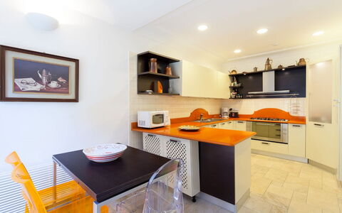 Villa Castore: Furniture, Kitchen, Countertop, Interior Design, Kitchen Appliance, Flooring, Major Appliance, Cabinetry, Wood, Ceiling