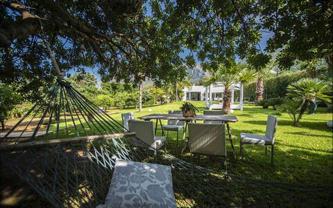 Villa Corallo: Tree, Grass, Shrub, Garden, Landscape, Land Lot, Lawn, Shade, Landscaping